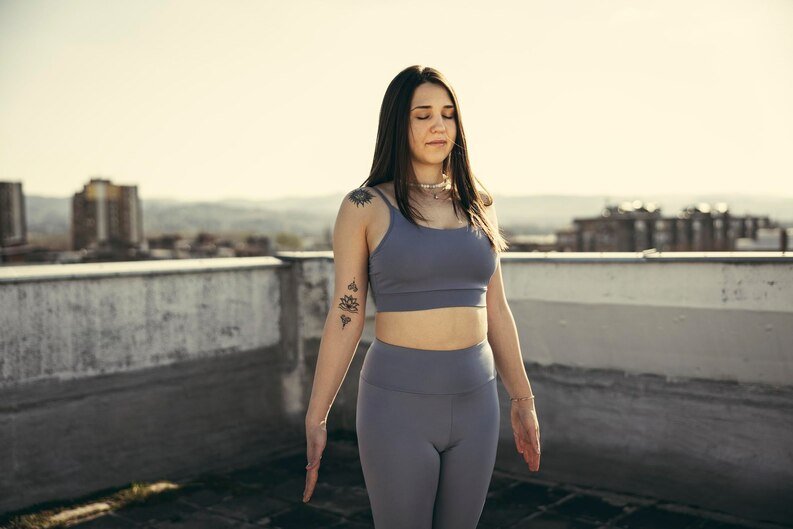 Woman doing Hatha Yoga asana Tadasana - Mountain pose with stretched hands  isolated Stock Photo - Alamy