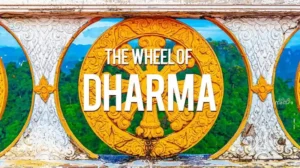 Golden Wheel of Dharma with ornate carvings, framed by a decorative arch, set against green hills and blue sky, with the text The Wheel of Dharma.