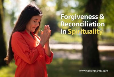 Woman in prayer pose practicing forgiveness and spiritual reconciliation outdoors.